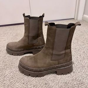 Olive green combat boots. I love them. A smidge too small. Wore them once.